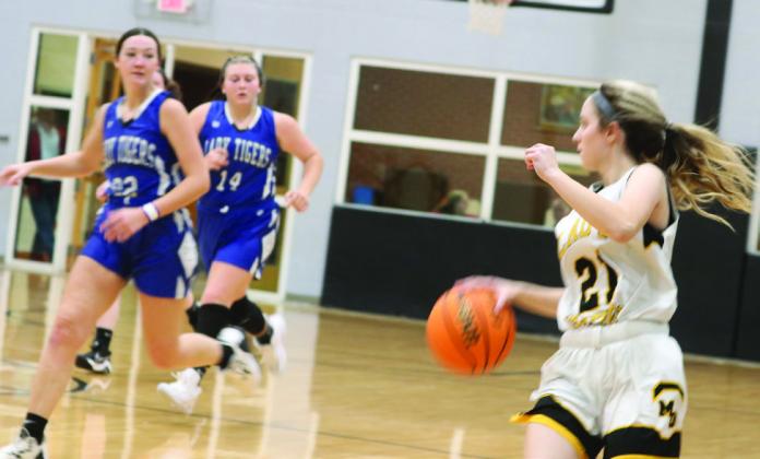 Mulhall-Orlando's Emily Parsons works the fast break against Union City on January 7.