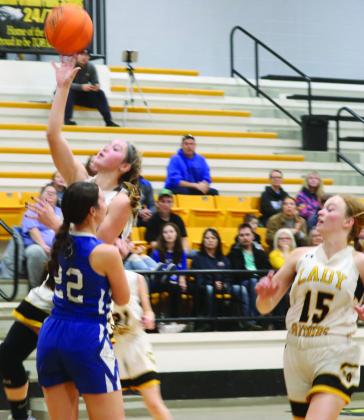 Lady Panthers Emily Parsons shoots the ball as Codie McNeil looks for the follow-up.