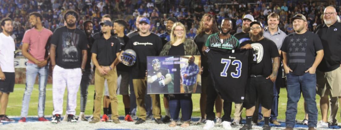 Pictured above, The Guthrie High School football team of 2011 which was undefeated and won the third of the school’s four state championships in Stillwater. It is one of three undefeated teams in the history of Guthrie football. The team beat an undefeated McAlester team in Sapulpa in the semifinals in gale force winds and freezing temperatures. The Bluejays then traveled to Boone Pickens Stadium on a Friday morning and beat an undefeated Lawton MacArthur team for the title, a team averaging 54 points a gam