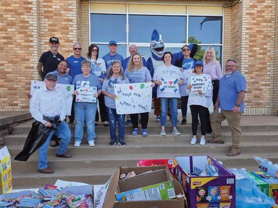 Representatives from the Guthrie Chamber of Commerce, chamber ambassadors and school officials traveled campus to campus to celebrate support staff members throughout Guthrie Public Schools. Photo courtesy Guthrie Chamber of Commerce.