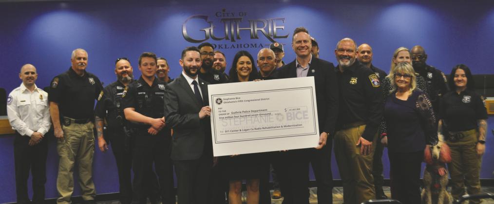Congresswoman Stephanie Bice with city leaders and law enforcement officers at the check presentation Feb. 17. Photo by Nikki Bos