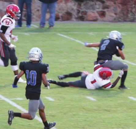 DeAndre Jones with the catch and run as Jaylen Chelf moves in to help