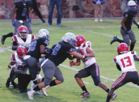 Isaiah Hammons takes advantage of the block by Joe Matthews to get through the Carl Albert defense