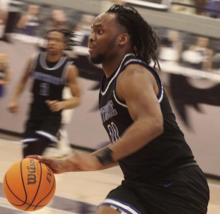 Alex Clark on drive to basket against Midwest City.