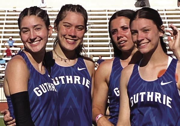 Guthrie High track athletes, from left, Cora Leach, Madi Brooks, Haley Gallo and Jackie Howell, celebrate after winning a Class 5A state championship in the 4x400-meter relay at the state track meet in Oklahoma City on May 17. Photo by Michael Kinney.
