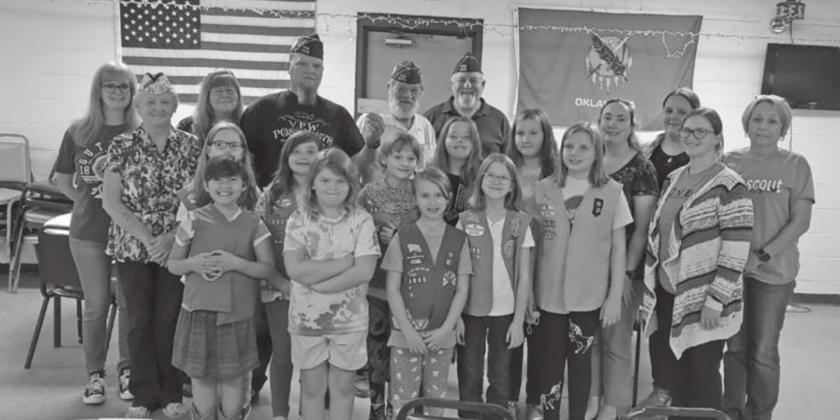 VFW Post #4578 Commander, Nicholas Erwin and other officers holding a check that was donated to Girl Scouts Western Oklahoma Troop 3005. After receiving the check, the girls voted to use some of the proceeds to make Birthday Boxes for House of Jesus, so that children who can’t afford a birthday can still celebrate.