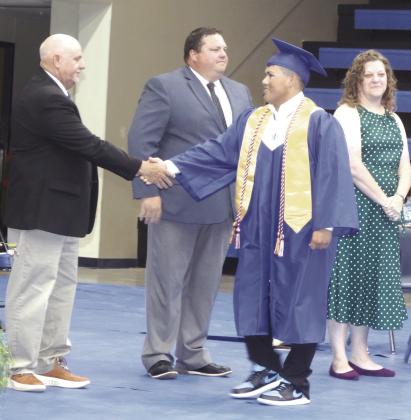 Coyle Graduation-Shane Weathers congraulates Joaquin Amaro.