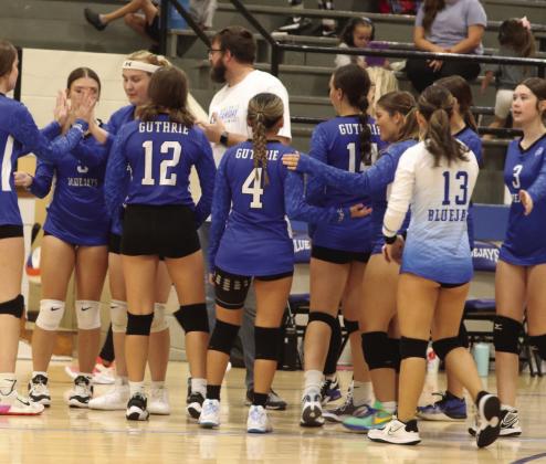 GHS JV VB Coach Josh Smith talks to team after 28-26 set win against Elgin.
