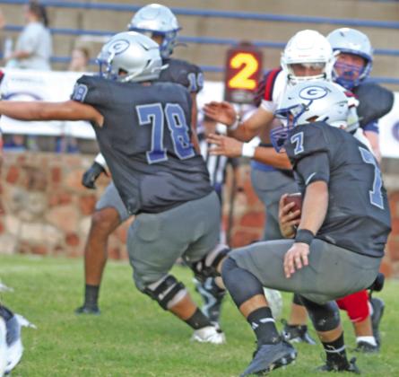 Bluejays quarterback Hayden Clvert looks for running room behind Cooper Walters.