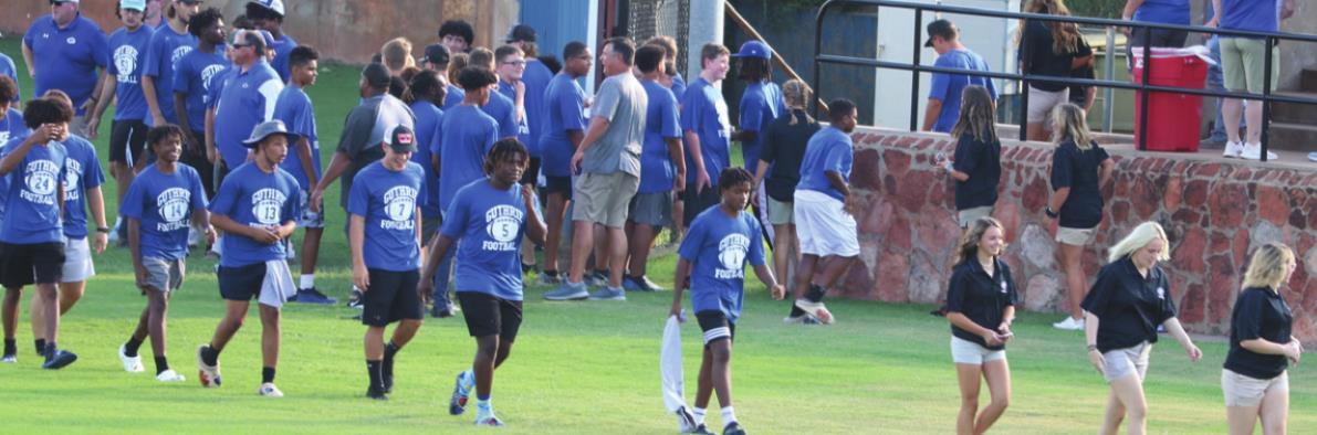 Varsity fb enters the field at Meet the Jays
