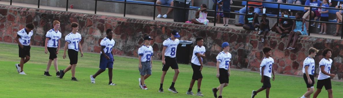 Football players at meet the jays