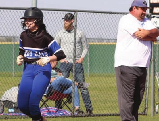 Guthrie’s Kassie Hall home run as she passes Guthrie Head Coach Booker Blakely