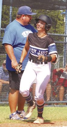 Guthrie Softball Haley Gallo home run trot as Head Coach Booker Blakley looks on.