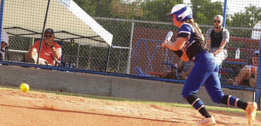 Katelynn Seiss with a sacrifice bunt. Photos Mike Monahan.