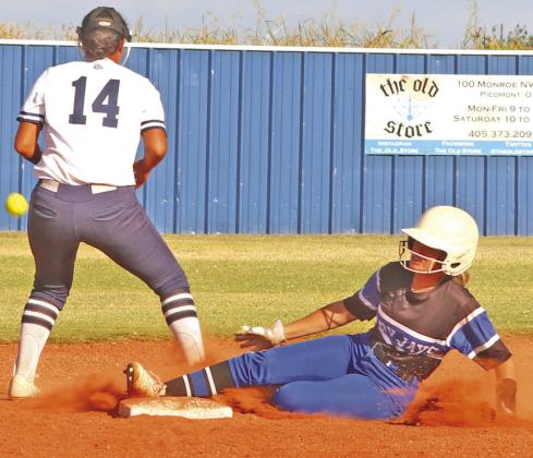 Sage Driscoll slides into second base after a key hit in game 2.