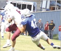 Eli Moroney sacks Tuttle quarterback.