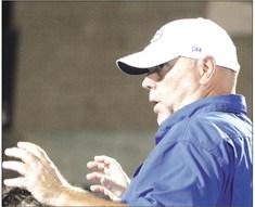 Head Coach Kelly Beeby at end of game talks to the team.
