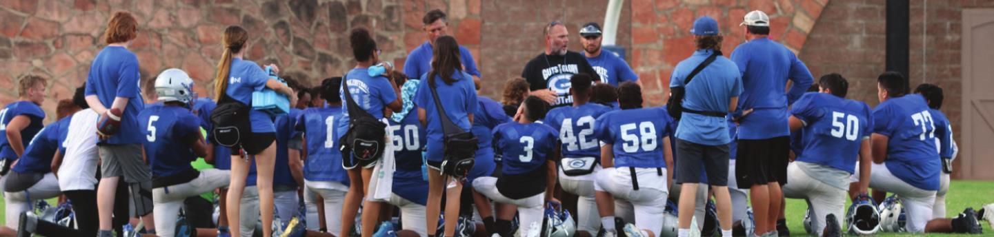 Coach Beeby talks to his players after the junior varsity scrimmage