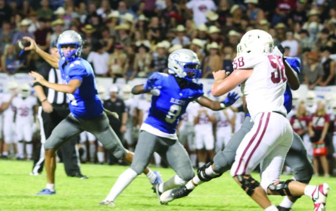 GHS FB Jaelon Rice rolls out looking for reciever.