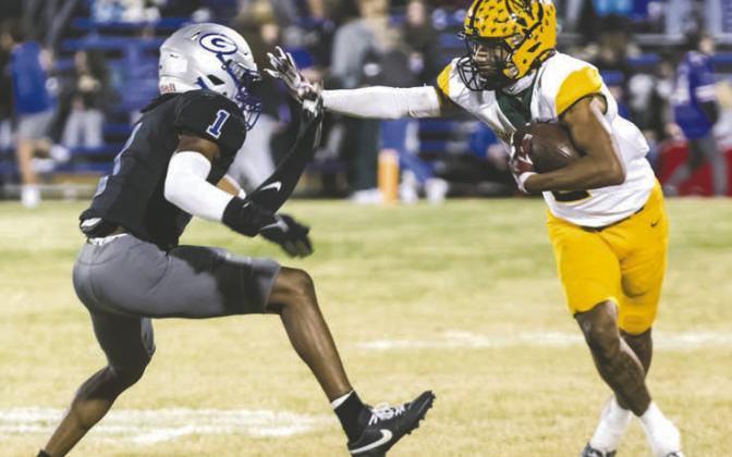Nate Benford works on bring Highlander reciever to the ground.