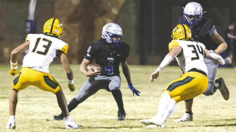 Jaylen Harper eludes Lawton MacArthur defenders.