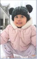 Haylie enjoys playing in her very first snow. Photo submitted by Katelyn Sue Hinkle Payne