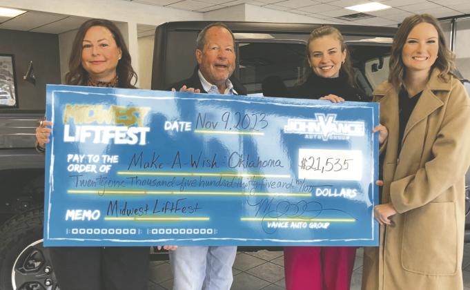 Pictured are Megan Vance Ochs and John Vance presenting the check to_Madison Boyle and Grace Wolf of Make-a-Wish Oklahoma. Photo by Blake Shipman