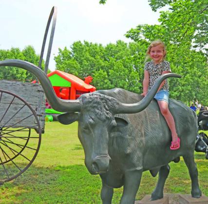 Mesa Harman enjoys the Longhorn Steer at Mulhall Days.