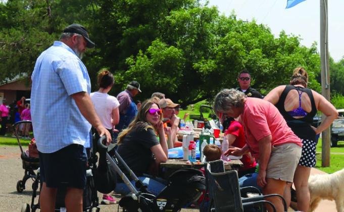 Mulhall days visitors enjoying lunch from various food trucks.