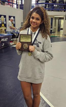 Eva Luna-Ellis with her Most Falls in the Least Time award. Photo courtesy of Guthrie Wrestling