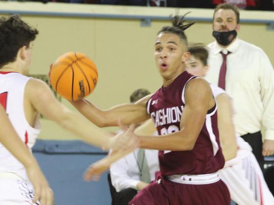 Raney drives to the basket. Photos by Mike Monahan