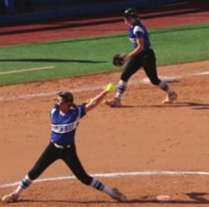 Tucker McKenna at third, Kinley Duehning pitching the ball and Eadie Jobe sneaking in a first base