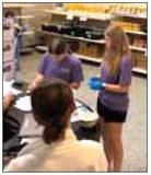 Volunteers at God’s Food Bank in Guthrie clean the facility and sort food for distribution to families in need. Photo Submitted