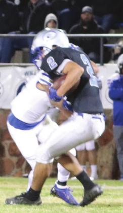 DeAndre Jones takes the hit after the catch