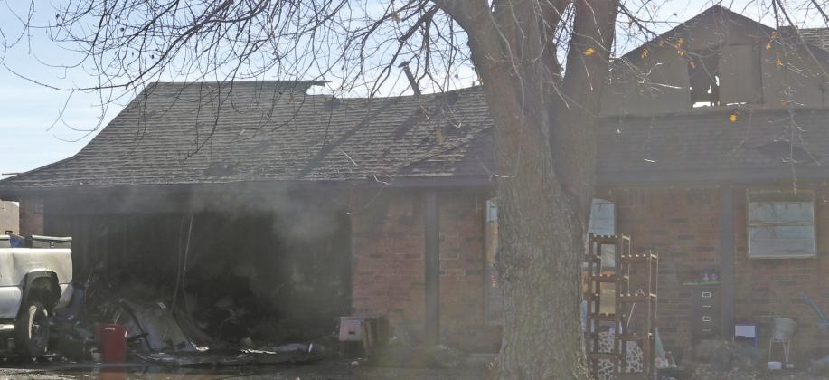 An early Monday morning fire in the 1700 block of Ken Drive caused extensive damage to the house. The fire was called in around 3:30 a.m. and required assistance from Oak Cliff and Sooner Fire Departments. The roof collapsed on the back of the house. The cause of the fire is still under investigation. Photo by Mike Monahan