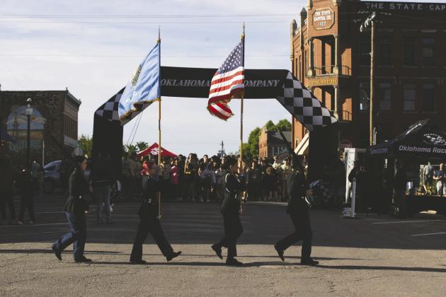 Guthrie High School JROTC cadets from the ’89er Battalion present the colors during the National Anthem at the annual ’89er Battalion 5K on Saturday, April 18. Photo by Brent Fuchs