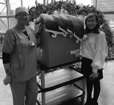 The Auxiliary of VFW Post 4578 purchased and delivered 25 fuzzy blankets to the patients at OU Medical Center undergoing chemotherapy. Pictured in scrubs is Auxiliary member and hospital liaison, Amanda Donham with a representative from OU. The Auxiliary Children’s Christmas party is this Saturday, December 17th at noon. Every child will receive a gift and can meet Santa. Light refreshments will be served.