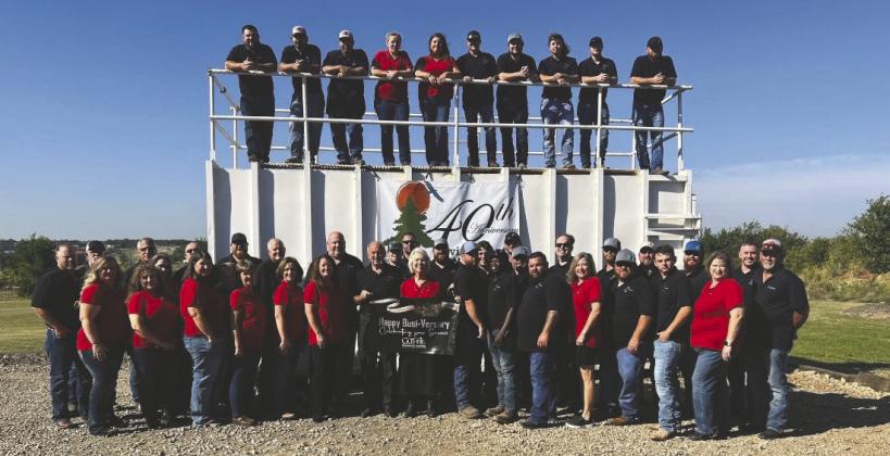 Employees and leadership of Environmental Management Inc. (EMI) gathered in Guthrie in 2023 to celebrate the company’s 40th anniversary. Photo courtesy of EMI.