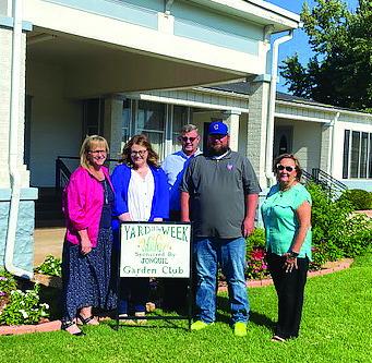 The Jonquil Garden Club has selected 117 E Noble Ave as the Yard of the Week. Pictured are Lynette, Hope, Chuck and Cody Hayes with Club Member Kala Plagg.