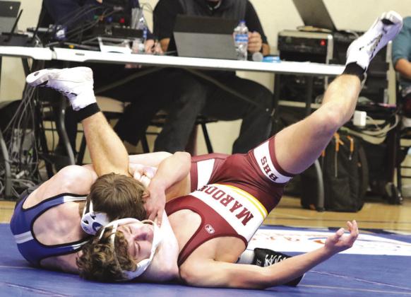 Kaedin Herendeen does battle with Lounde n Wolfe in 113 Kaedin Herendenn looks to get out of Louden Wolfe hold. pound match.