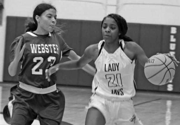 Guthrie’s Ania Morgan drives past Klavdia Ryan of Daniel Webster on Dec.17
