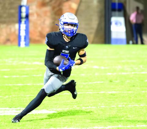Guthrie quarterback Daelon Rice runs away from an El Reno defender during the Bluejays’ 42-0 win on Oct. 10. Rice completed 17 of 24 passes for 190 yards and three touchdowns.