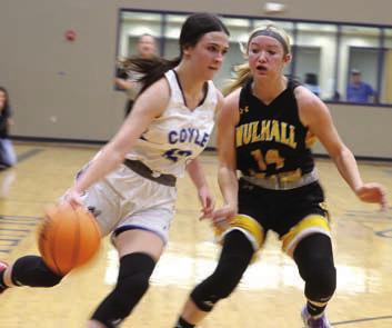 Coyle’s Gracie Balsiger drives by Mulhall-Orlando’s Kaylee Day. Photos by Mike Monahan