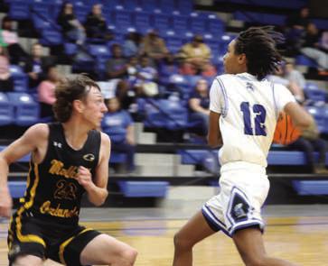 Coyle’s Jace Lemons runs fast brek against Mulhall-Orlando’s Tatum Kime.