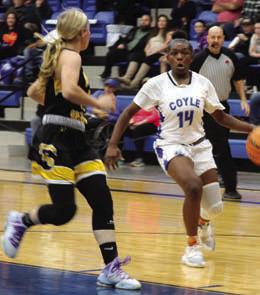Coyle’s Sierra Young works fast break against Emily Parsons.
