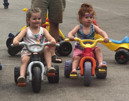 Jessie Linn, and sister Autumn Belle get ready for the Annual '89er Big Wheel Race