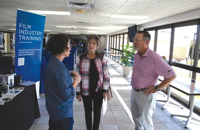 Sen. Chuck Hall speaks with Meridian Technology Center’s Cara Adney and Guthrie’s Lanette Mize, one of Merdian’s first graduates in 1976