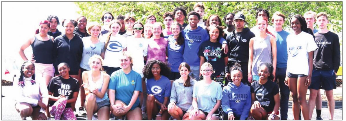 Pictured Above, Members of the Guthrie High School track team that has won meets at Bethany and Shawnee in the last three weeks. The teams travel to Ponca City tomorrow as their season winds down with Suburban Conference meet in Piedmont on April 29. Photos by Mike Monahan