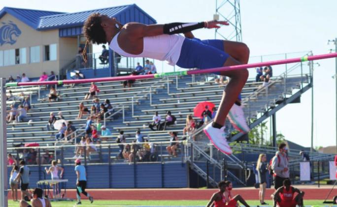 Kaiden Ballard Stevenson clears high jump bar