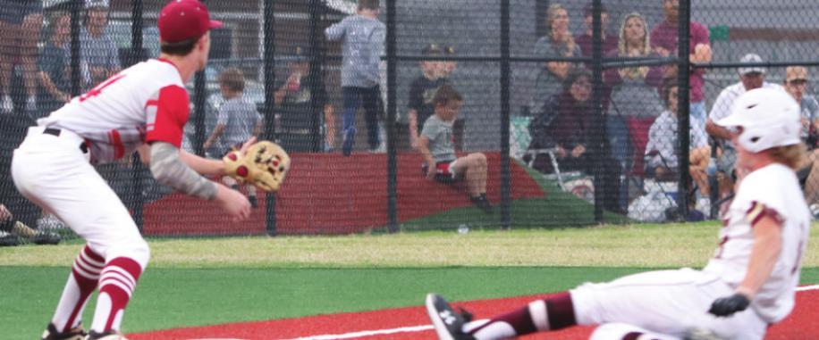 Cashion’s Joey Wilson sliding into third base on his triple off the wall